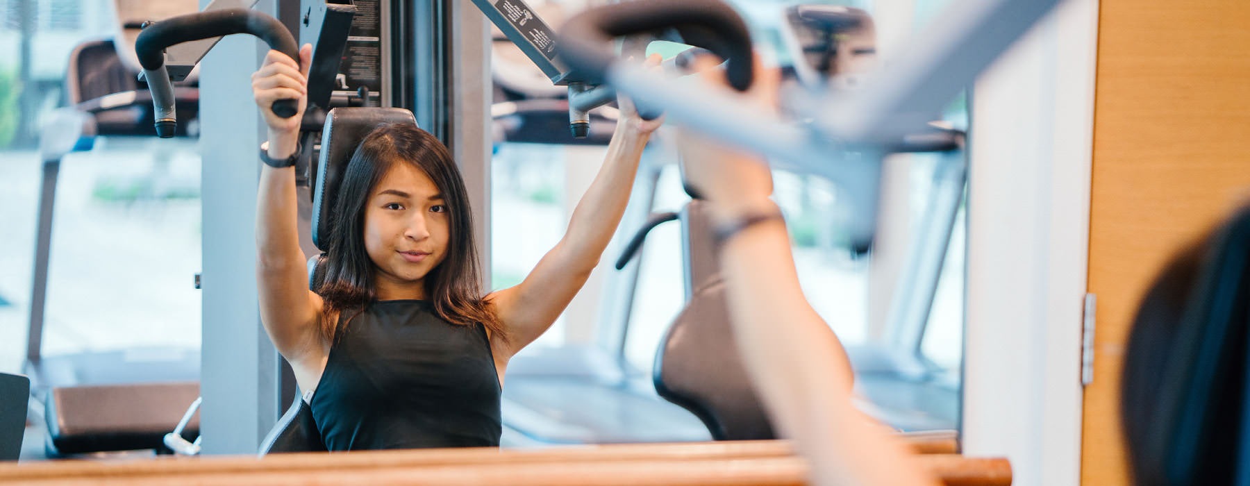 girl exercising in fitness center