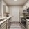 Well lit galley kitchen with stainless steel appliances at Heron Lake