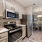 Modern kitchen with open counter adjacent to dining area in apartment homes at Heron Lake