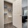 Hallway linen closet with built-in shelving at Heron Lake