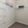 Walk-in closet with light and shelving at Heron Lake