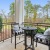 Furnished patio with railings and nature views at Heron Lake