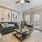 Naturally lit living room with access to private balcony at Heron Lake