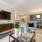 Open space living room open to kitchen and dining area at Heron Lake