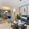 Open concept living room with bright lighting in apartment homes at Heron Lake