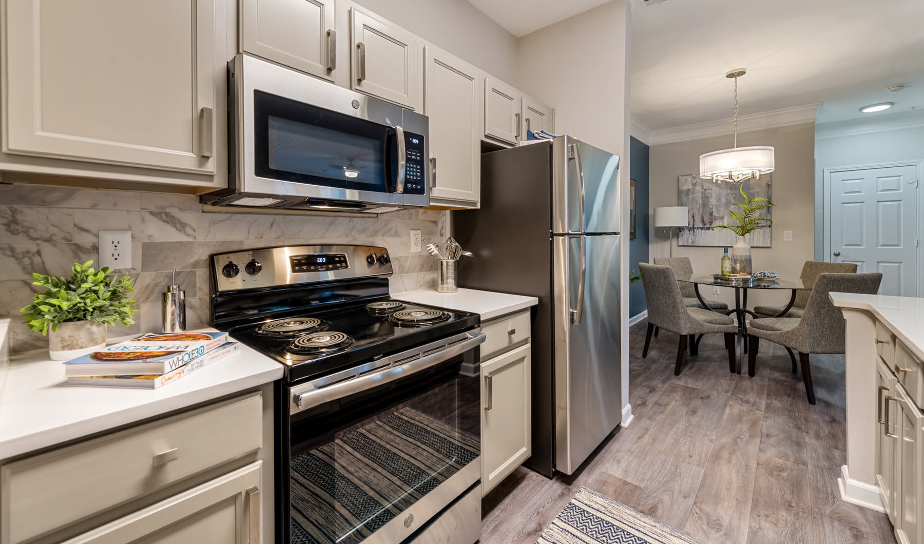 Custom Style at Every Corner galley kitchen with open counter adjacent to dining area
